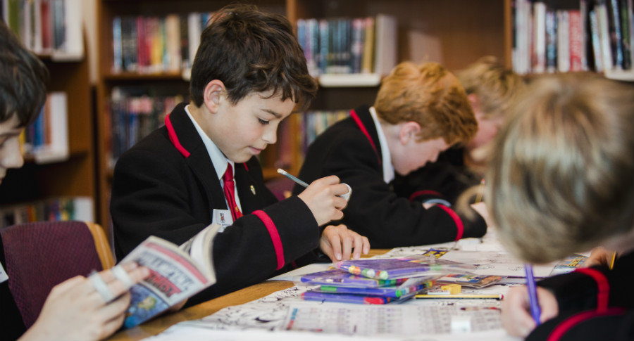 Boys reading in library